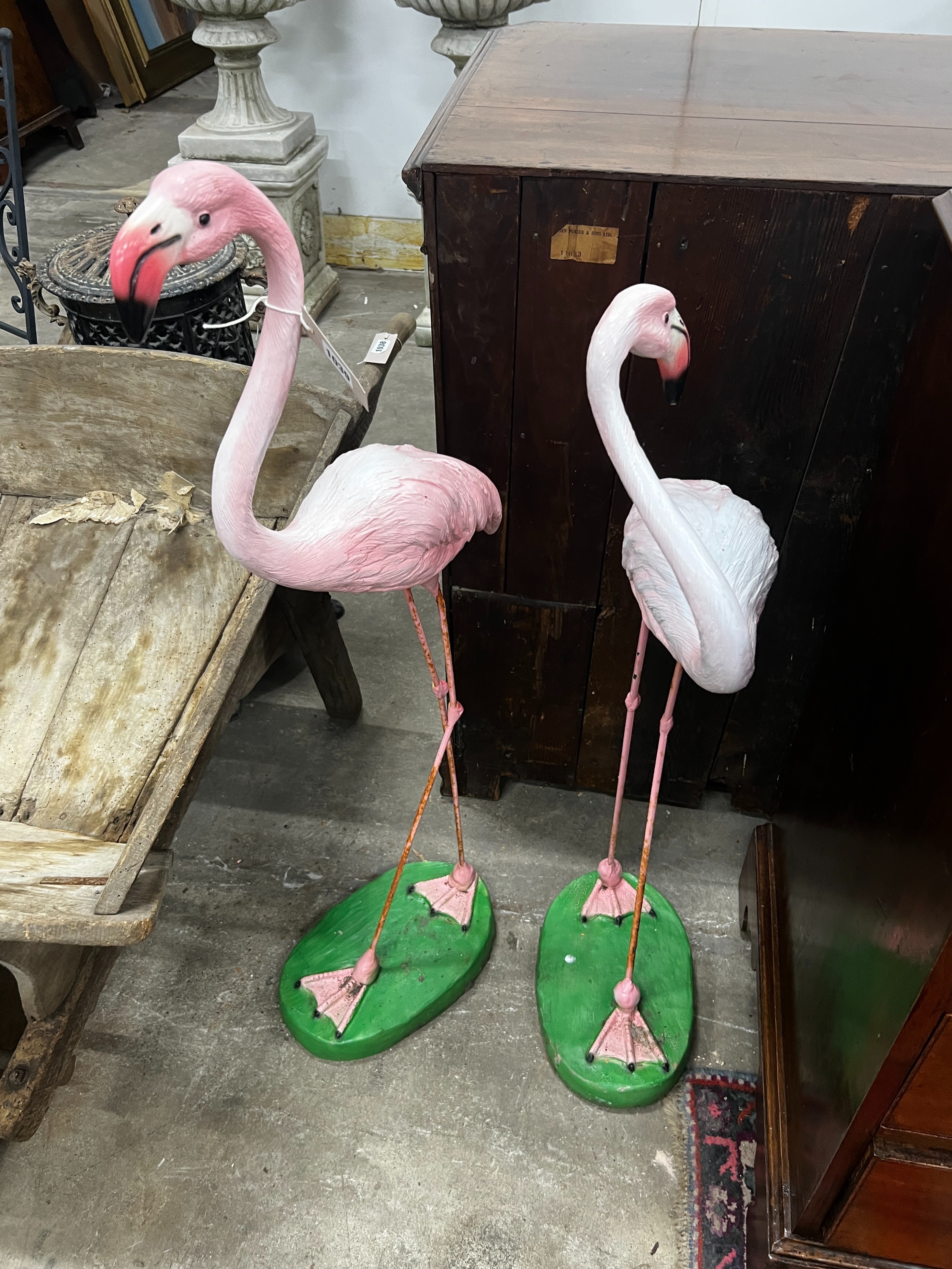 A pair of flamingo garden ornaments, larger height 103cm